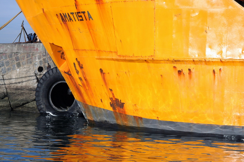 tire, boat, land vehicle, nautical vessel, close-up, water, mode of transportation, accidents and disasters, black color, ship, container, valparaiso, orange color