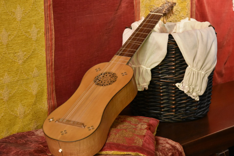 no people, clothing, europe, string instrument, medieval, destination, electric guitar, cervantes, brown, close-up, house of cervantes, landmark, fashion