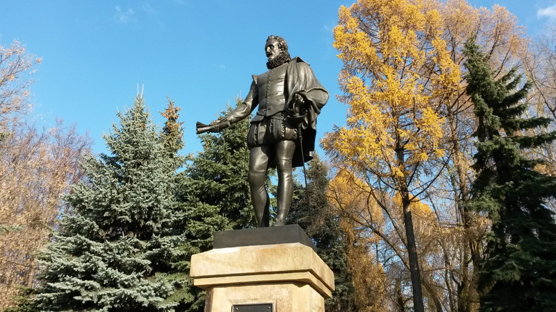 sculpture, religion, statue, autumn, representation, art and craft, architecture, sky, memorial, male likeness, plant, tree, growth, miguel de cervantes