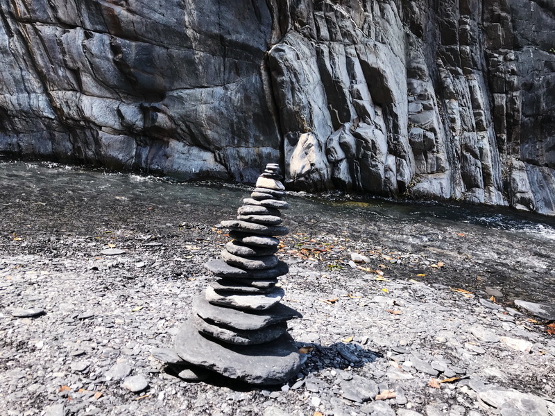 stone - object, day, direction, road, flagstone, asphalt, solid, balance, sidewalk, path, rubble, sunlight, pebble, rock, rock formation, limestone, tarmac