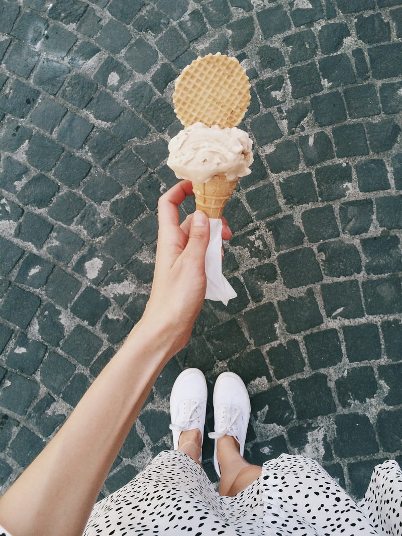 food and drink, 2K, ice cream cone, lifestyles, walking, street, temptation, woman, human limb, frozen, high angle view, personal perspective, human body part