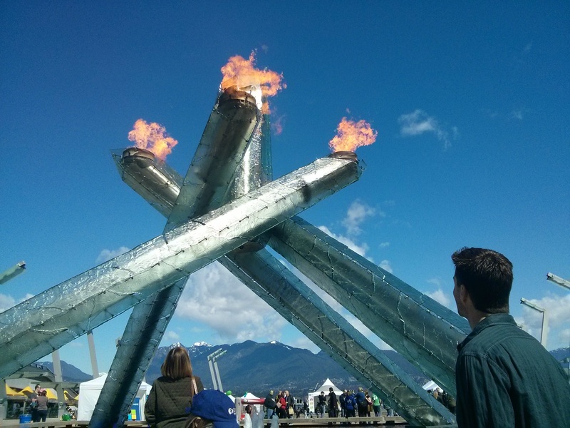 real people, olympic torch, canada, adult, blue, burning, group of people, architectural column, men, olympics, cauldron, women, flame, leisure activity