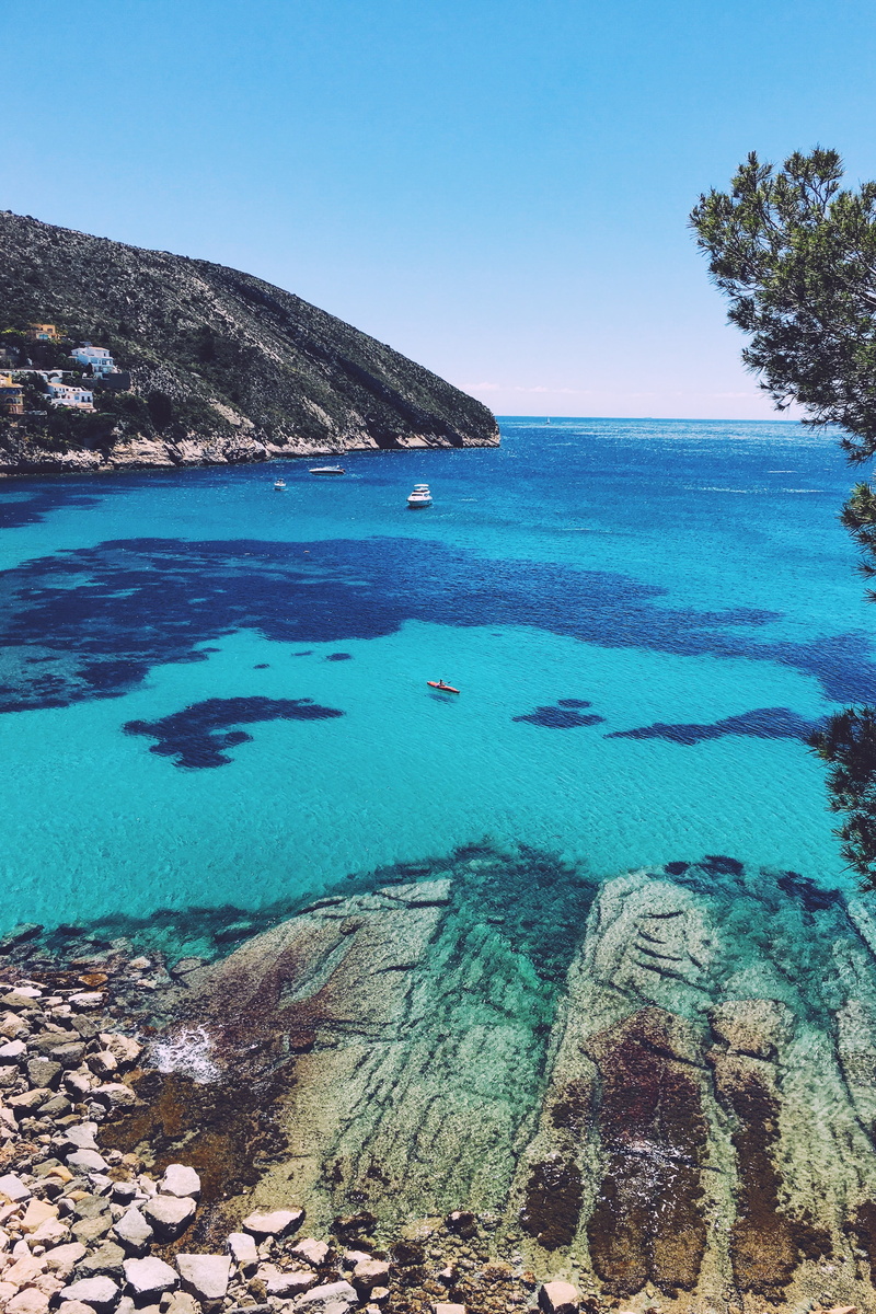 rocks, scenics, ripples, solid, tranquil scene, clear sky, tranquility, tree, no people, clear, idyllic, mountain, water, horizon over water, boats, scenics - nature