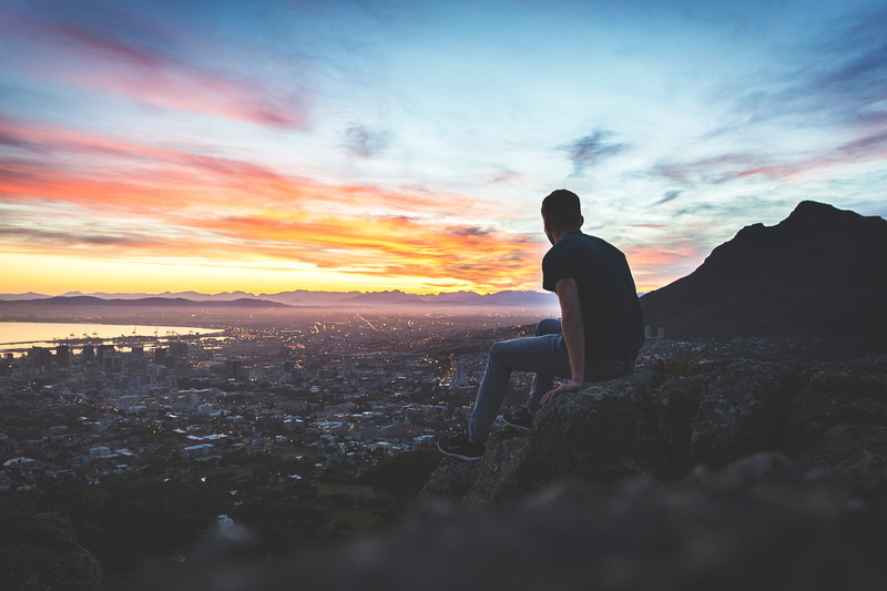 scenics - nature, tranquil scene, city, nature, standing, men, outdoors, tranquility, cliff, land, real people, leisure activity, sitting, guy, one person