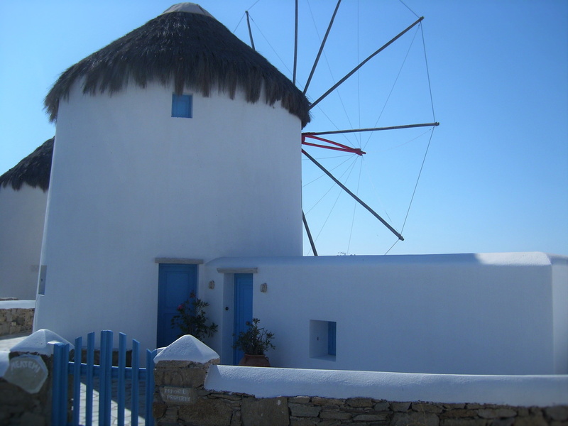 sky, travel, turbine, no people, built structure, cyclades, alternative energy, clear sky, greece, day, mill, building, white, roof, blue, nature, white color