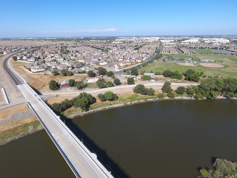 high angle view, no people, built structure, connection, mossdale tract, cityscape, 4K, river, bridge, building exterior, sky, tree, homes, outdoors, plant