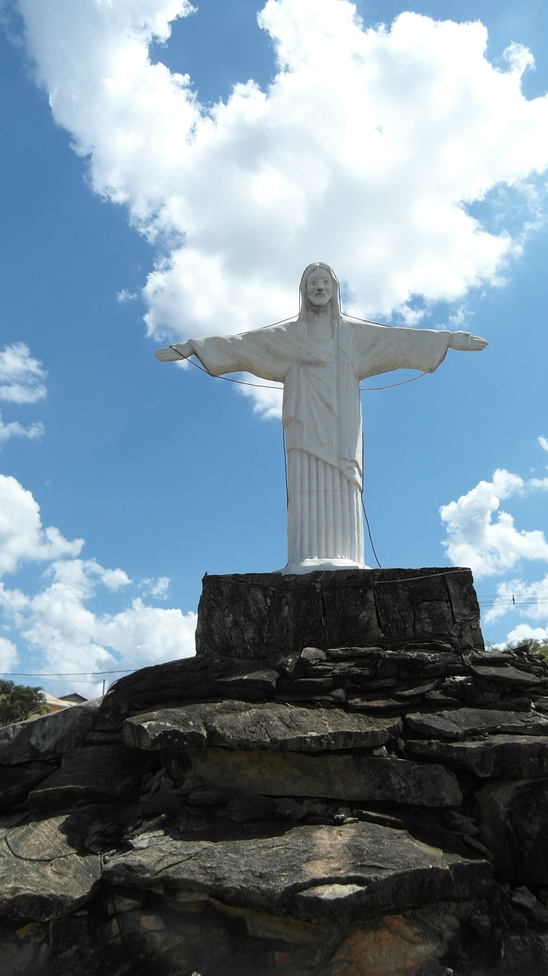 spirituality, outdoors, male likeness, Christo, belief, clouds, human representation, day, craft, low angle view, creativity, art and craft, Minas Gerais
