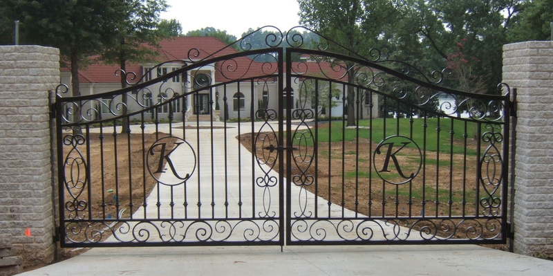built structure, gate, tree, entrance, barrier, fence, protection, iron - metal, graffiti, outdoors, communication, building exterior, day, boundary, safety