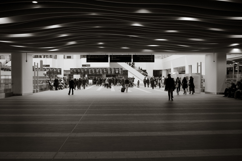 illuminated, people walking around, ceiling, lighting equipment, people walking, transportation, people, crowd of people, lifestyles, flooring, leisure activity