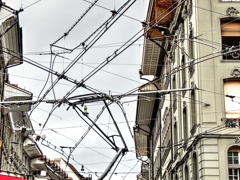 outdoors, technology, wires, sky, cables, metal, residential district, power supply, low angle view, built structure, window, pantograph, fuel and power generation