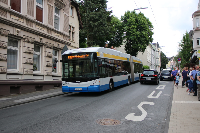 bus, swiss trolley, public transportation, tree, city bus service, built structure, nature, day, cable car, sign, outdoors, land vehicle, transport, track