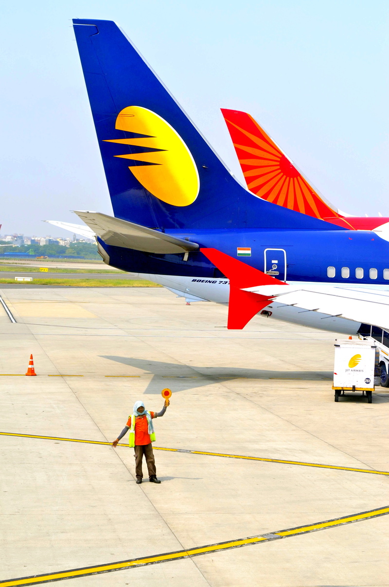 full length, airlines, india, air india, airport, rear view, human, people, lifestyles, airplane, jet, tourism, airliner, real people, airfield, plane