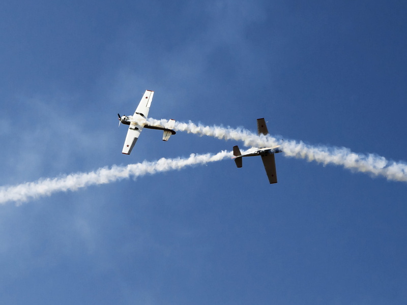 outdoors, stunt, 2K, mode of transportation, air, low angle view, performance, on the move, smoke - physical structure, mid-air, blue, aerobatic, vapor trail