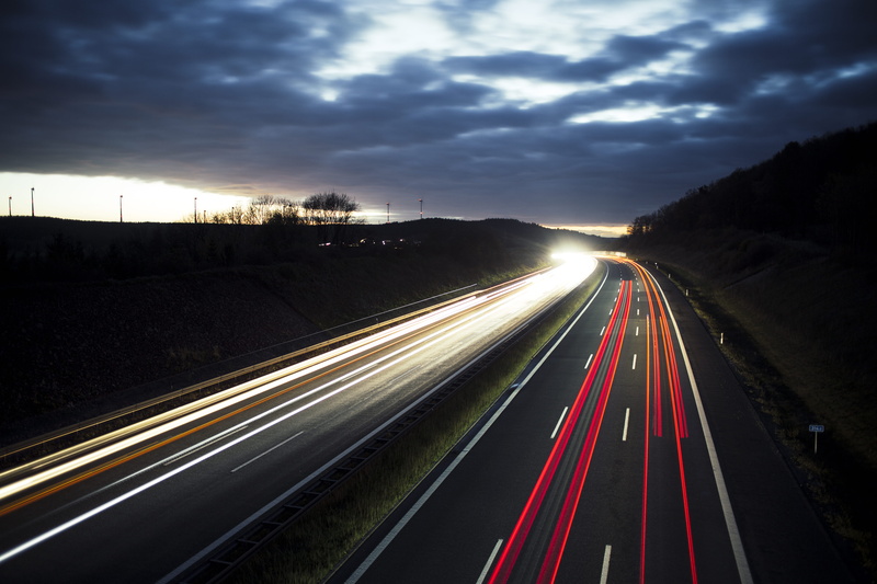 light trail, cloud - sky, sky, speed limit, long exposure, the way forward, spänfleck, city, illuminated, blurred motion, motorway, high angle view, multiple lane highway