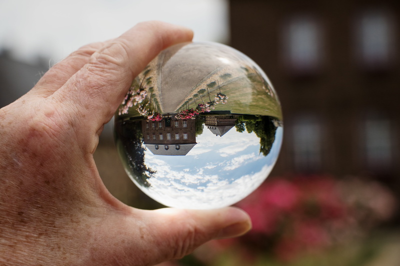 building exterior, architecture, human hand, building, historically, finger, globe - man made object, focus on foreground, planet earth, glass ball photo