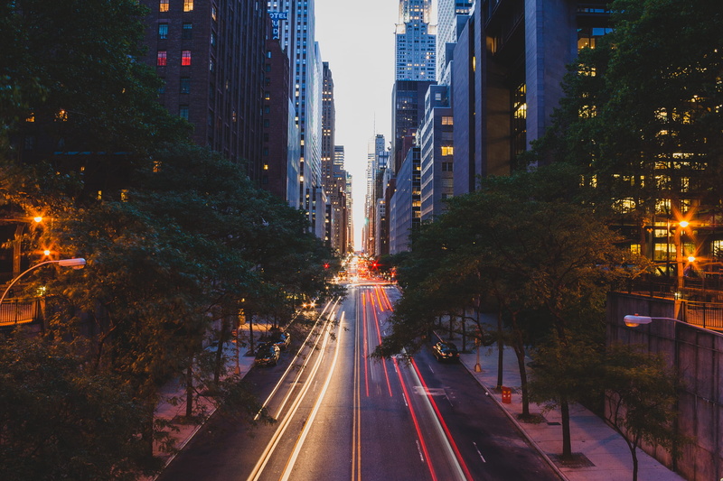 city, motor vehicle, city street, motion, office building exterior, tree, city life, long exposure, nyc, cityscape, diminishing perspective, outdoors, transportation