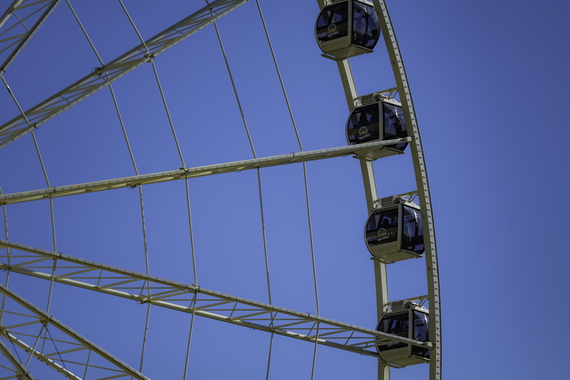 outdoors, built structure, tourist, connection, metal, riders, amusement, lighting equipment, park, blue, construction industry, utility pole, tourist trap