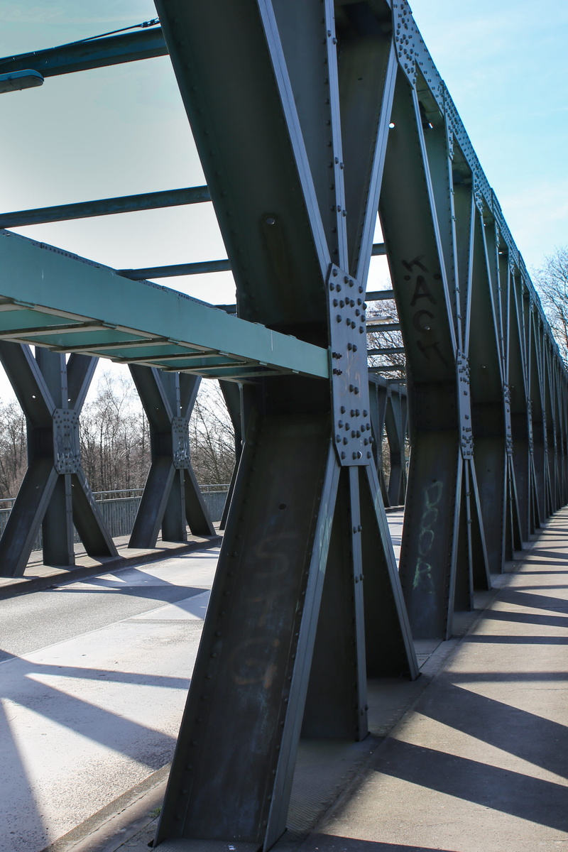 bridge - man made structure, wheel, steel beams, steel bridge, architecture, metal, footpath, transportation, railing, sky, day, nature, girder, road, built structure