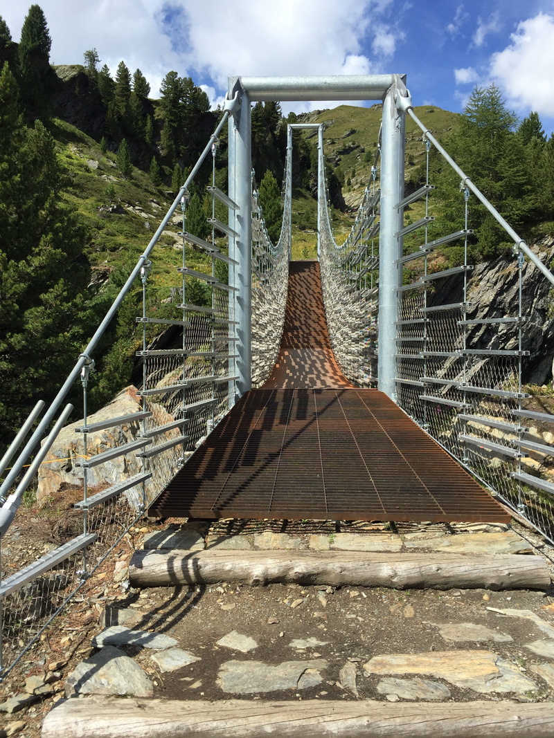 built structure, steel cables, tree, no people, outdoors, rope, connection, sunlight, nature, south tyrol, bridge - man made structure, sky, railing, bridge