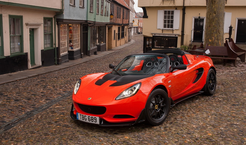 transportation, building, residential district, red cars, stationary, day, car, red, built structure, luxury, outdoors, architecture, building exterior