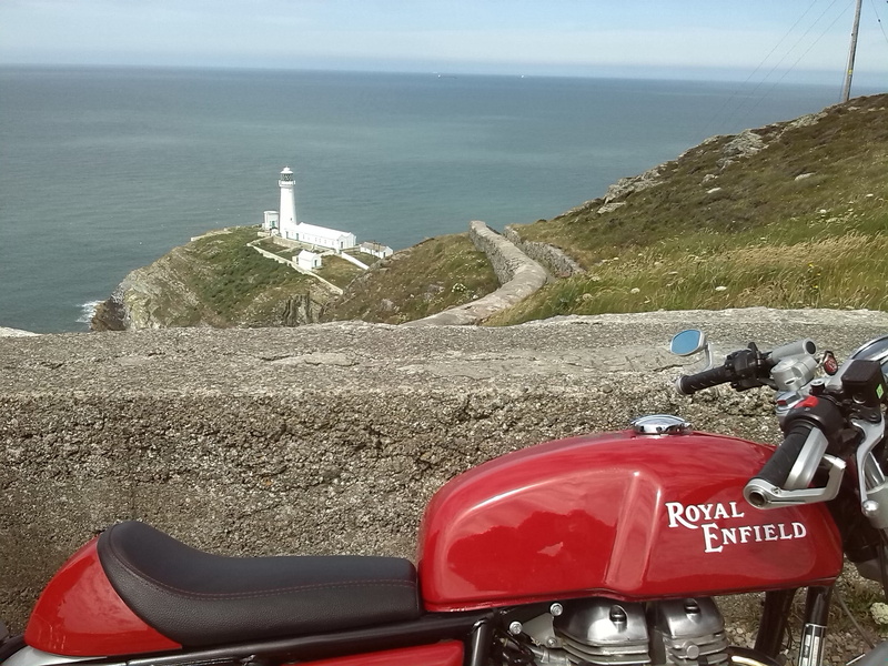 western script, text, motorcycle, mode of transportation, horizon over water, red, transportation, outdoors, sea, sky, nature, scenics - nature, motor
