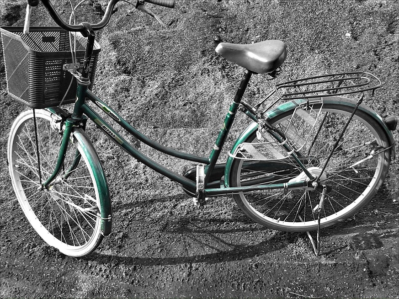 basket, parked, absence, spoke, sunny, outdoor, parking, transportation, grounds, street, gray, day, sunlight, nature, land vehicle, bright, mode of transportation