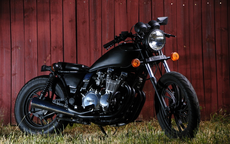 mode of transportation, no people, motorcycle, helmet, Yamaha, field, outdoors, 2K, metal, day, land vehicle, transportation, black, parking, stationary