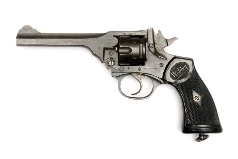 studio shot, military, white background, webley revolver, social issues, protection, single object, violence, communication, sign, weapon, automatic, side view