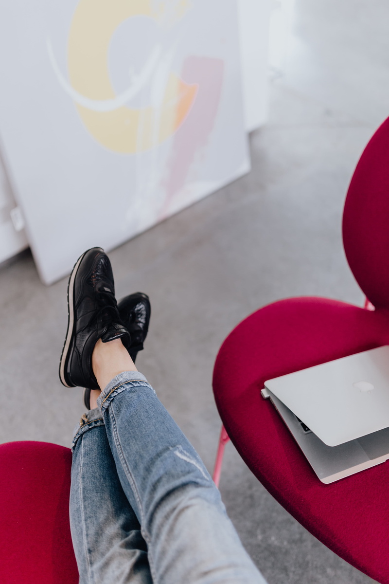 young adult, girl, 5K, real people, lifestyles, macbook, laptop, day, blogging, low section, study, sofa, adult, work, female, casual clothing, sneakers