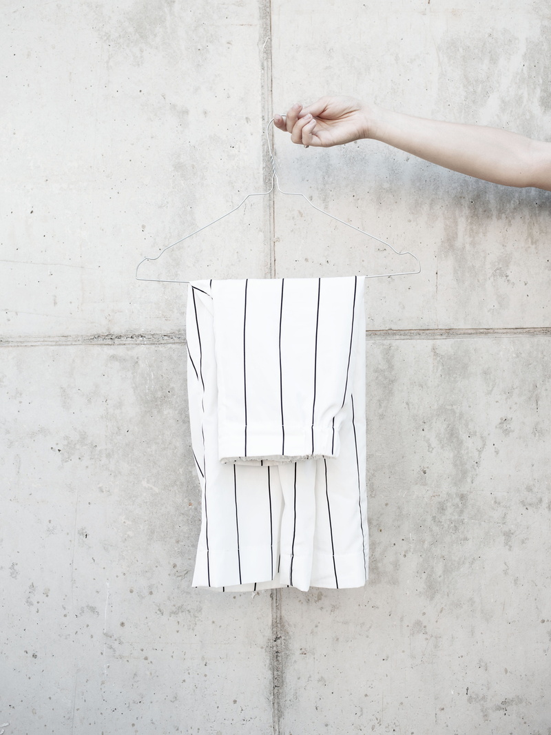 caucasian Ethnicity, culotte, trouser, hanger, white, outdoors, style, architecture, building, holding, wall - Building Feature, backgrounds, person, one Person