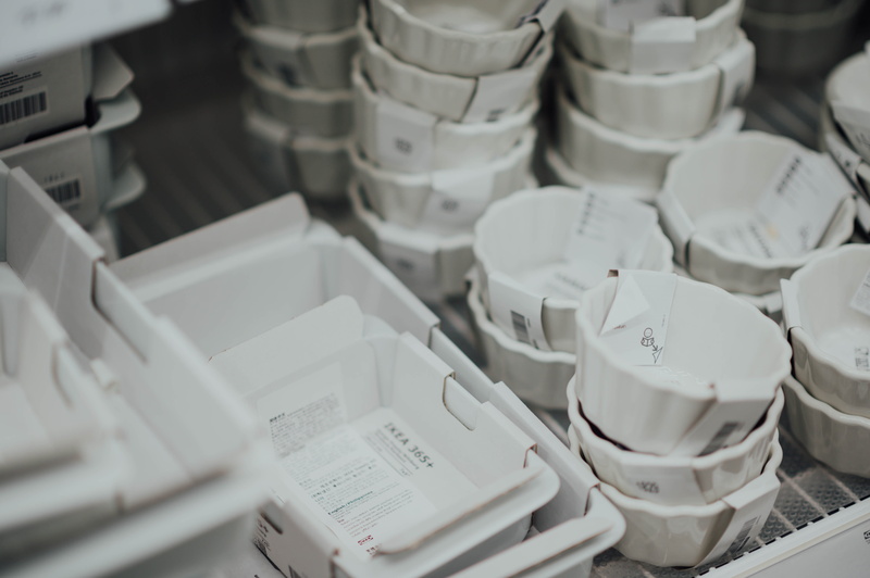 selective focus, dish, indoors, focus on foreground, electronics, bowl, close-up, helmet, stack, container, white color, furniture, pottery, ceramic, business