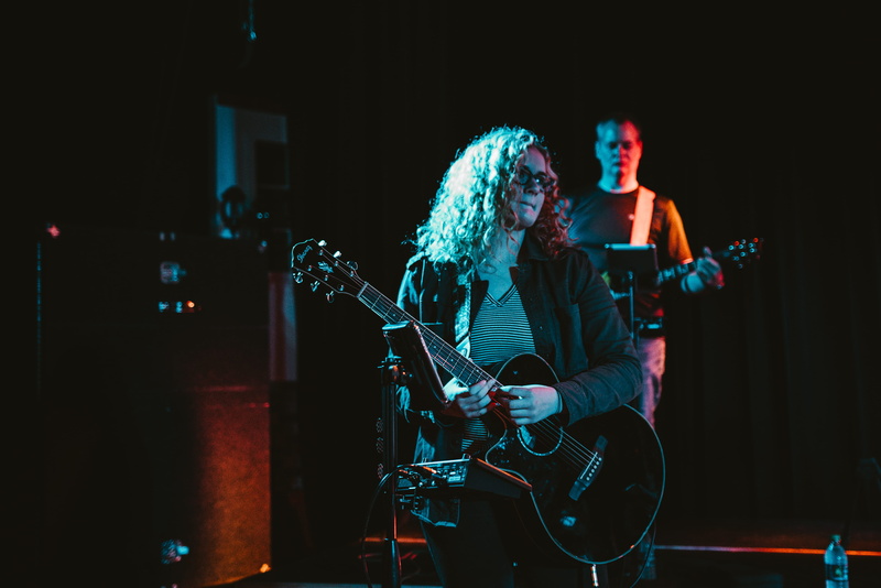 computer hardware, guitar, stage, playing, skill, performer, indoors, town, illuminated, input device, les, lighting, hardware, urban, plucking an instrument