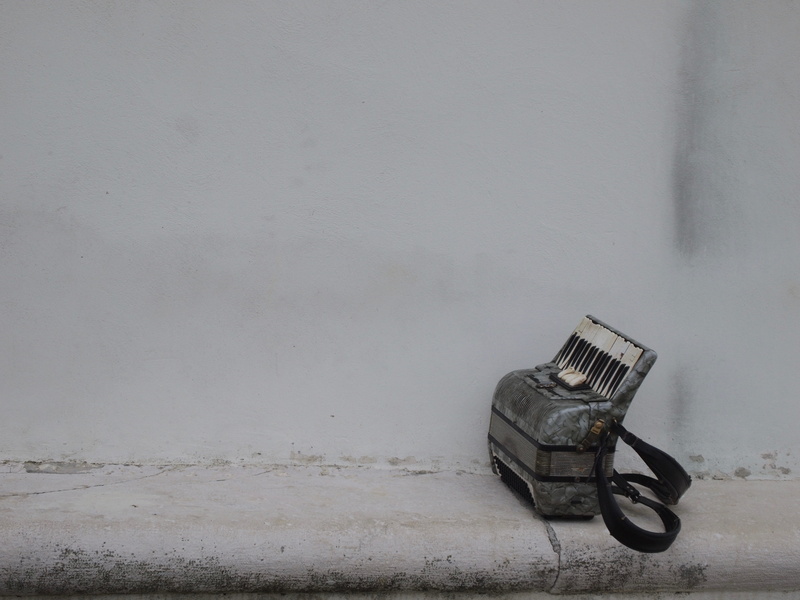 instrument, absence, furniture, adapter, art, metal, land vehicle, surface, wall, high angle view, accordion, harmonium, no people, transportation, concrete