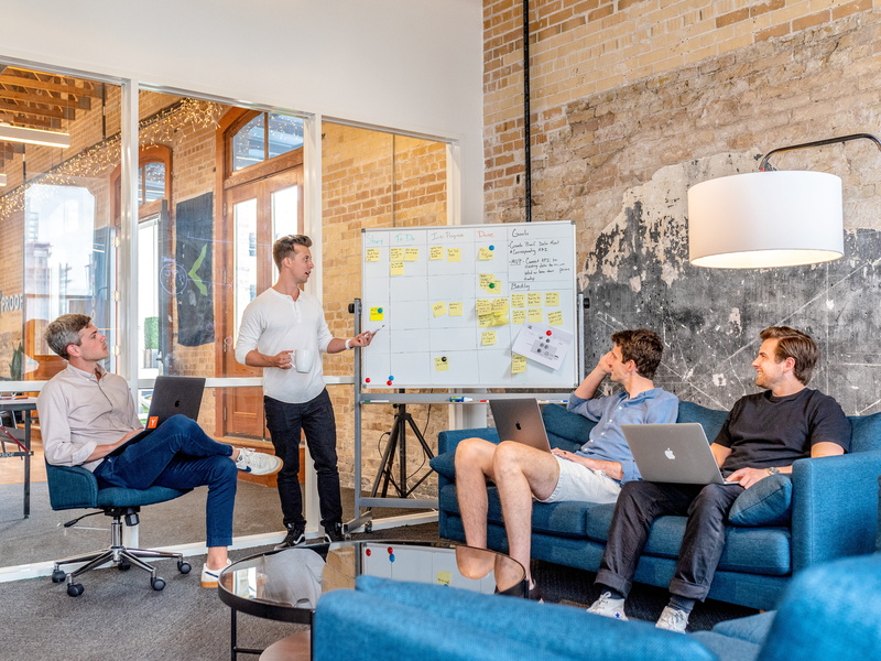 males, 5K, computer, electronics, person, men, teamwork, coworker, shoe, interview, furniture, chair, using laptop, human, apparel, couch, indoors, office