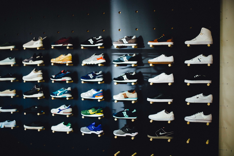 no people, wall - building feature, store, man made, abundance, shelf, retail, choice, bottle, 5K, in a row, running, day, objects, paper, Running shoes