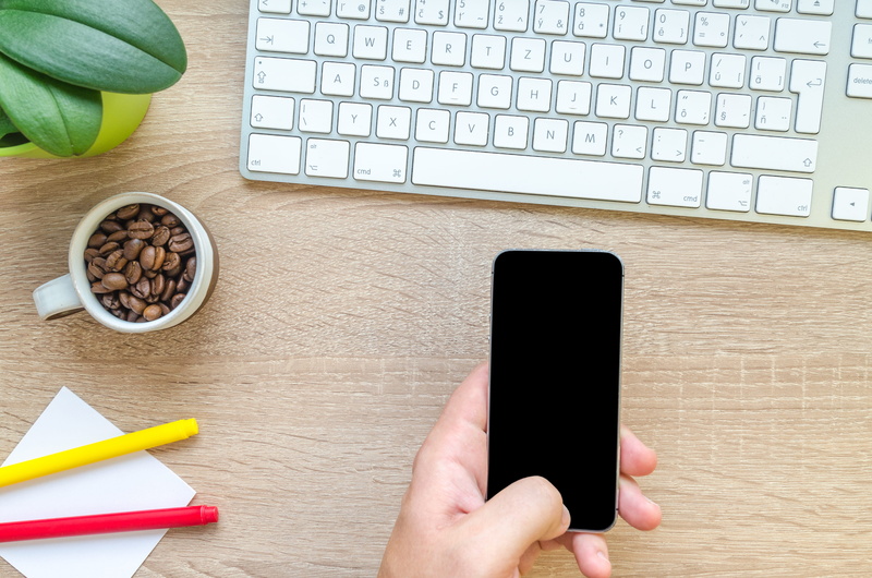 fingers, indoors, connection, hand, table, magic, mobile, leaves, food and drink, technology, plant, computer, mobile phone, wooden, roasted coffee beans