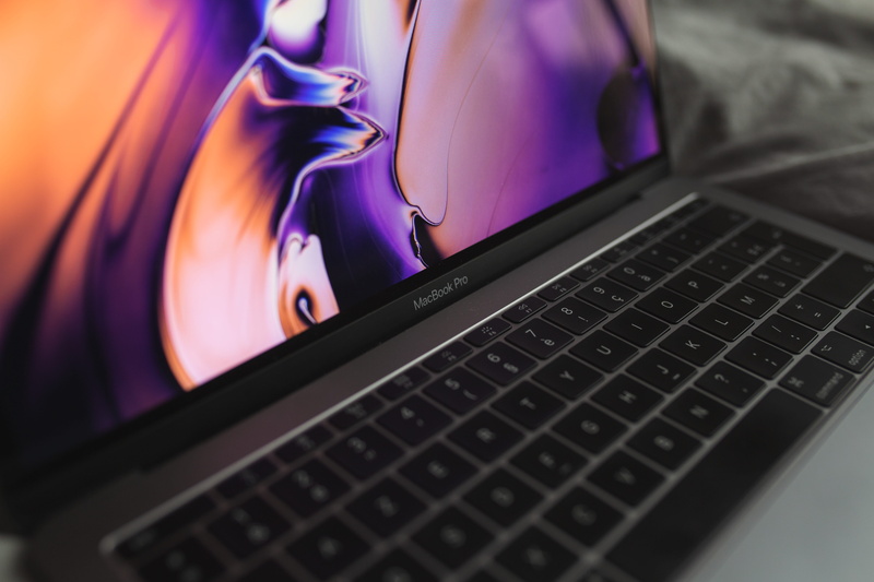 technology, video gaming, steering wheel, no people, connection, close-up, computer keyboard, desktop, furniture, night, laptop, purple, black color, monitor