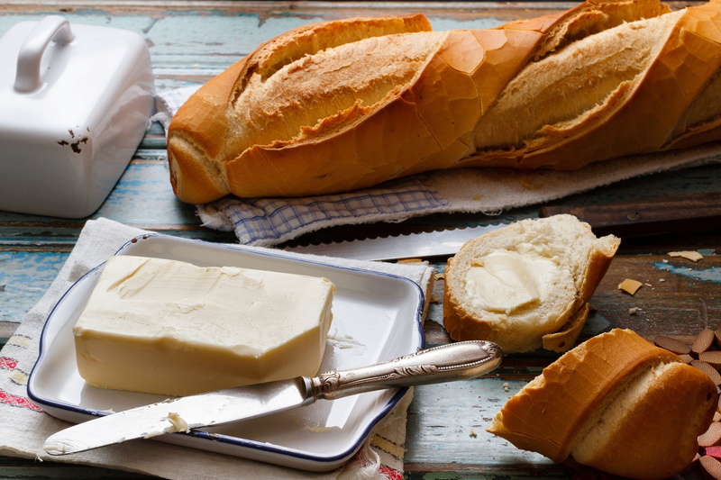 indoors, snack, wellbeing, still life, loaf of bread, bread, table knife, food, spread, knife, freshness, dairy product, oil, healthy eating, baton, no people