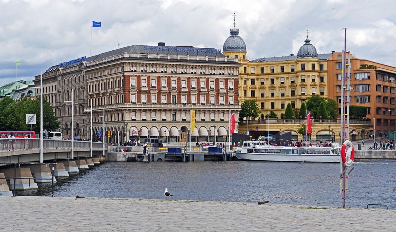 nautical vessel, incidental people, sky, cloud - sky, downtown, cruise ship, mode of transportation, Stockholm, government, bridge, investors, tourism