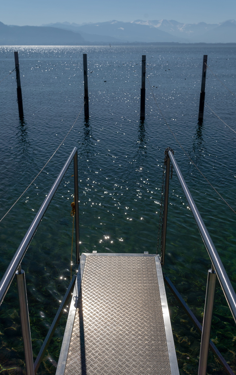 beauty in nature, post, pier, built structure, wood - material, sky, sea, web, railing, jetty, high angle view, metal, no people, cloud - sky, lake constance