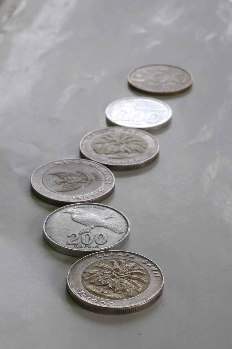 silver colored, group of objects, studio shot, money, 2K, still life, close-up, wealth, coin, indoors, focus on foreground, text, metal, number, communication