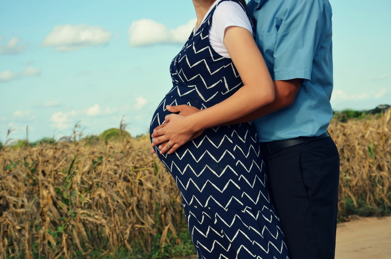 focus on foreground, love, hand, fields, plant, pregnant, result, human body part, midsection, couple - relationship, day, people, adult, family, casual clothing