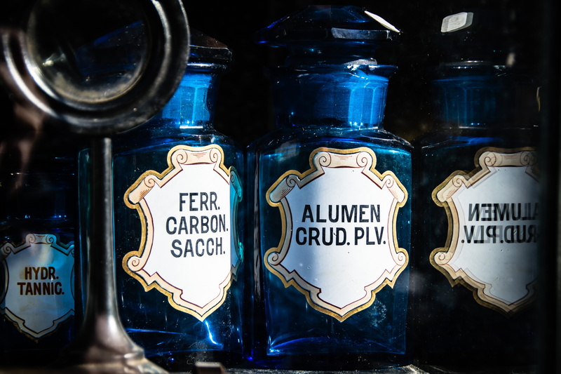 glass - material, glasses, bottle, large group of objects, close-up, blue, choice, 4K, selective focus, old, indoors, text, communication, pharmacy, variation