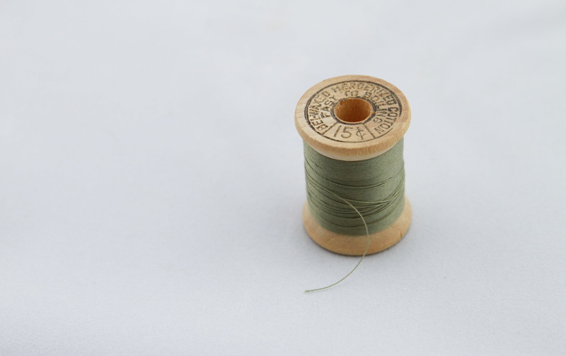 spool, indoors, embroidery, 4K, studio shot, tailor, green, art and craft, needlecraft Product, sewing, green thread, tape measure, finance, fashion, photo