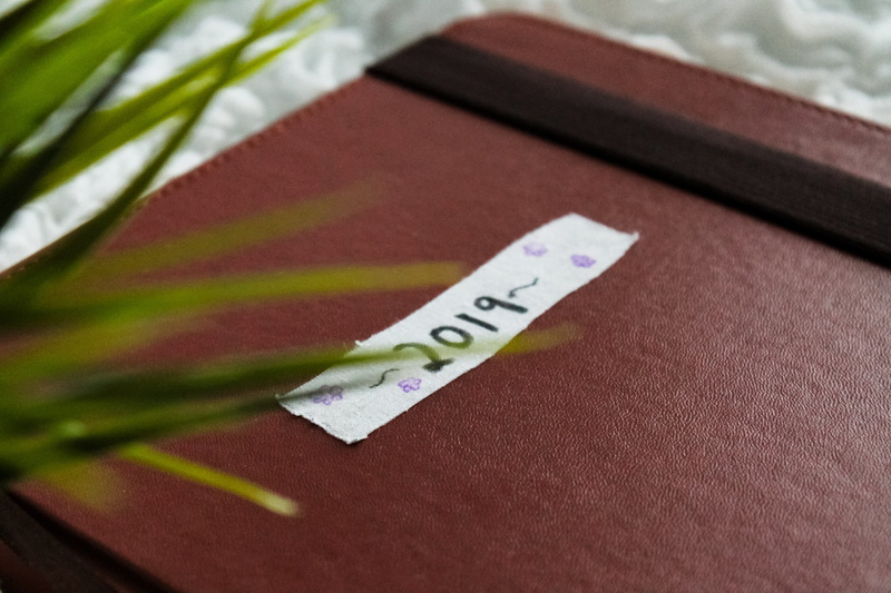 communication, file folder, focus on foreground, human hand, paper currency, table, asthetic, one person, green color, western script, book, selective focus