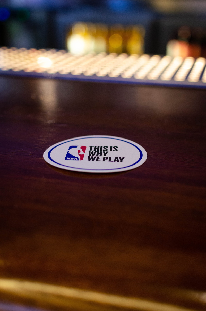 table, indoors, furniture, drinks, close-up, Barcelona, western script, nba, emblem, sign, shape, cocktails, number, coaster, this is why we play, technology