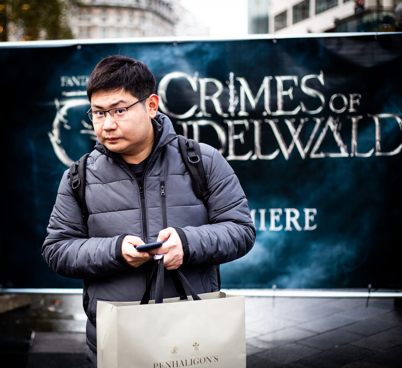 young adult, tote bag, technology, man, wireless technology, jacket, coat, bag, real people, bubble, clothing, brochure, portable information device, smart phone
