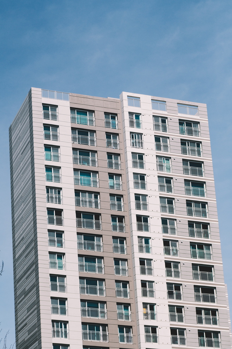 town, building, day, in a row, room, apartment building, window, awning, sky, high, no people, rise, clear sky, blue, outdoors, canopy, city, low angle view