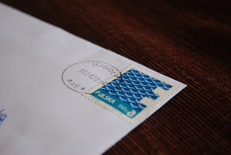 blue, text, table, document, stamp, no people, letter, mail, high angle view, the envelope, western script, finance, wood - material, postal codes, economy