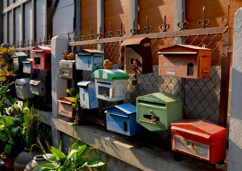 symbol, receive, letterboxes, boxes, mailbox, building, building exterior, send, junk, contact, sunlight, plant, correspondence, no people, delivery, architecture